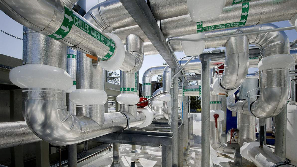Insulated chilled water return pipes with valves and supports