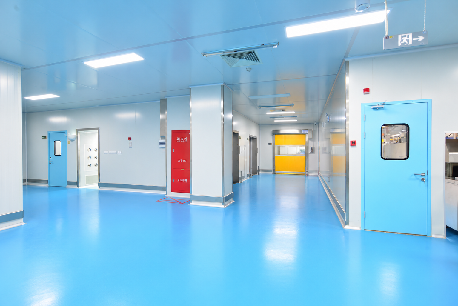 Blue doors, panel partitions and a cleanroom corridor